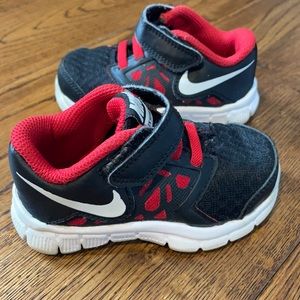 Nike red and black sneakers. 5 in baby.
